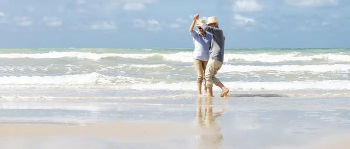 Retirement security couple on beach